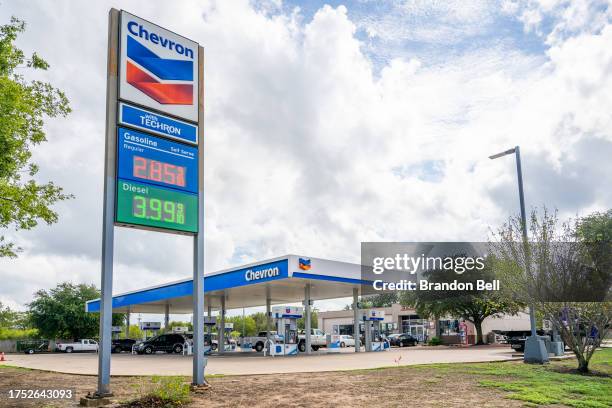 Chevron gas station is shown on October 23, 2023 in Austin, Texas. Chevron is acquiring Hess Corp. In a $53 billion deal that will be paid with...