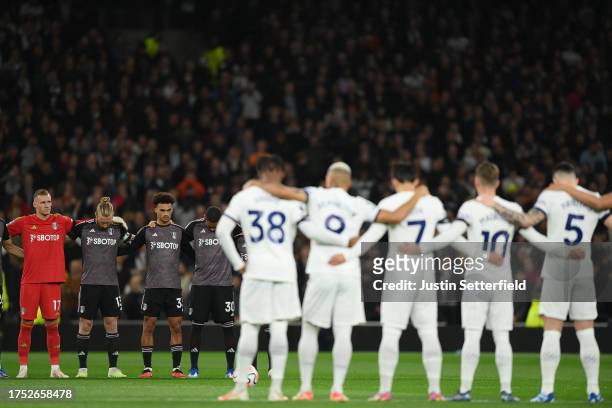 Players of Fulham and Tottenham Hotspur observe a minutes silence in remembrance of the victims of the recent attacks in Israel and Gaza prior to the...