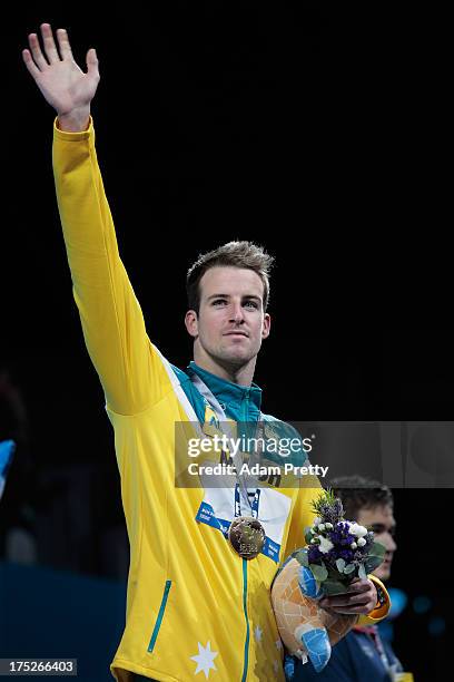 Gold medal winner James Magnussen of Australia celebrates on the podium the Swimming Men's Freestyle 100m Final on day thirteen of the 15th FINA...