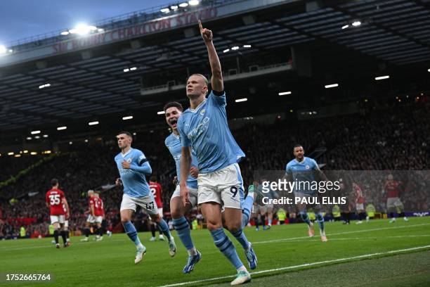 Manchester City's Norwegian striker Erling Haaland celebrates after scoring the opening goal from the penalty spot during the English Premier League...