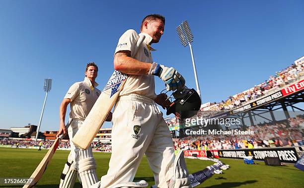 Michael Clarke and Steve Smith of Australia walk off at the end of play during day one of the 3rd Investec Ashes Test match between England and...