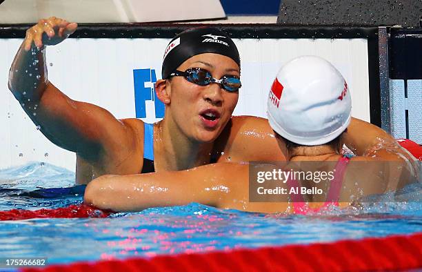 Aya Terakawa of Japan congratulates Jing Zhao of China after the Swimming Women's Backstroke 50m Final on day thirteen of the 15th FINA World...