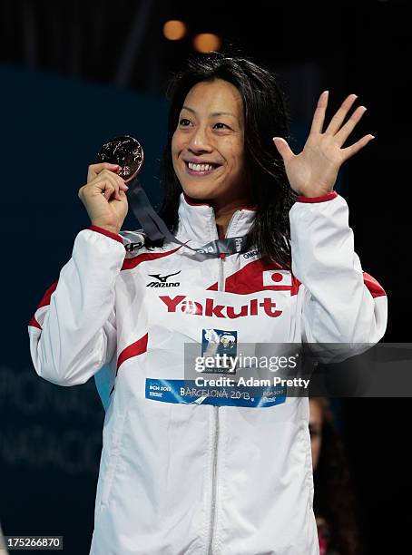 Bronze medal winner Aya Terakawa of Japan celebrates on the podium after the Swimming Women's Backstroke 50m Final on day thirteen of the 15th FINA...