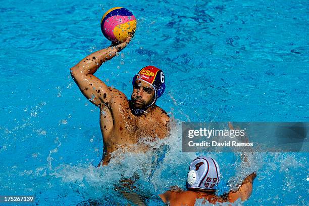 Marc Minguell of Spain in action against Vanja Udovicic of Serbia during the Men's Water Polo fifth to eighth place match between Spain and Serbia...
