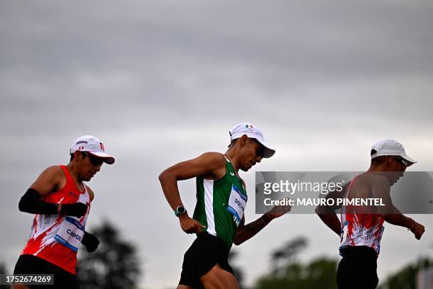 Peru's Luis Campos , Mexico's Jose Doctor and Peru's Cesar Rodriguez compete in the athletics men's 20km walk race during the Pan American Games...