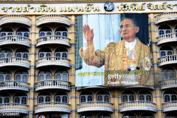 Huge billboard of king Rama IX in building , Bangkok , Thailand