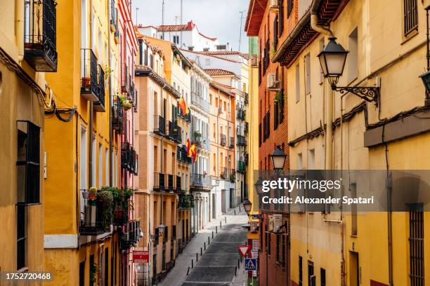 colorful street in madrid old town on a sunny day, spain - madrid stock pictures, royalty-free photos & images