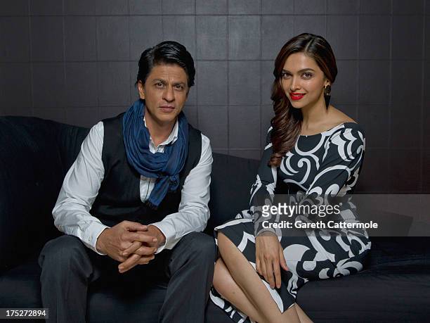 Actors Shah Rukh Khan and Deepika Padukone pose together during a portrait session at The Courthouse Hotel on July 30, 2013 in London, England.