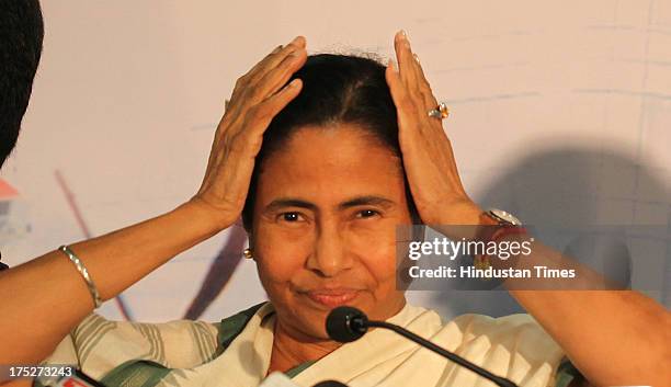 West Bengal Chief Minister Mamata Banerjee during a press conference after the investors summit at World Trade Centre on August 1, 2013 in Mumbai,...