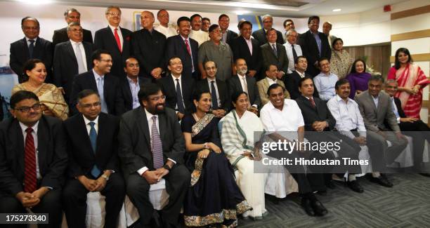 West Bengal Chief Minister Mamata Banerjee with top Indian industrialist and corporate leaders including Reliance Industry Chairman Mukesh Ambani,...