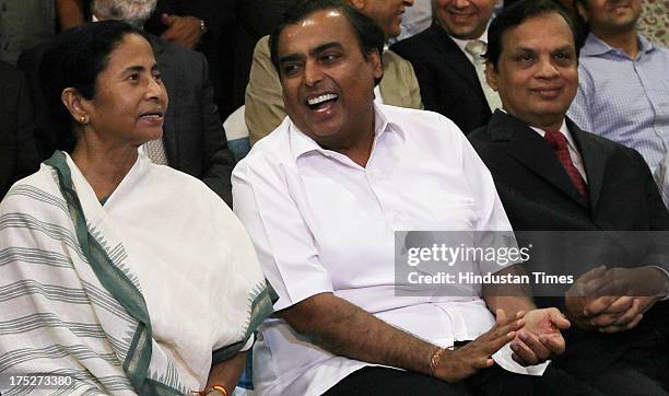 West Bengal Chief Minister Mamata Banerjee Reliance Industry Chairman Mukesh Ambani and Venugopal Dhoot of Videocon during the investors summit at...