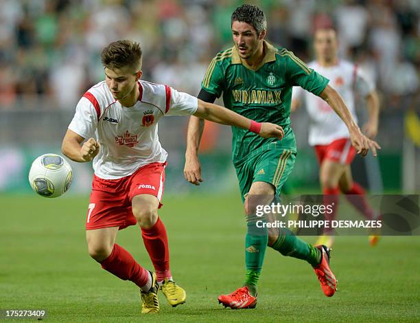 Milsami's Moldovian midfielder Andrei Ciofu vies for the ball with Saint-Etienne's French midfielder Fabien Lemoine during the UEFA Europa League...