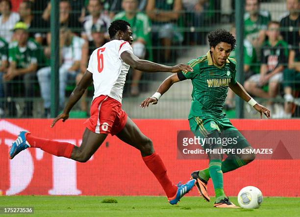 Saint-Etienne's Brazilian forward vies for the ball with Milsami's Nigerian defender Ovye Shedrack during the UEFA Europa League preliminary football...