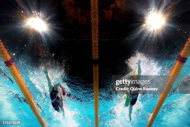 Shannon Vreeland of the USA and Kylie Palmer of Australia compete during the Swimming Women's Freestyle 4x200m Final on day thirteen of the 15th FINA...