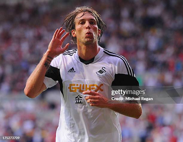 Michu of Swansea celebrates scoring to make it 1-0 during the UEFA Europa League third round qualifying first leg match between Swansea City and...