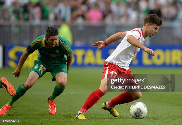 Milsami's Moldovian midfielder Andrei Ciofu vies for the ball with Saint-Etienne's French midfielder Fabien Lemoine during the UEFA Europa League...