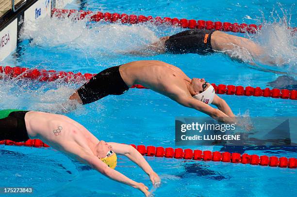 Australia's Matson Lawson, Britain's Craig McNally and Hungary's Peter Bernek compete in the semi-finals of the men's 200-metre backstroke swimming...