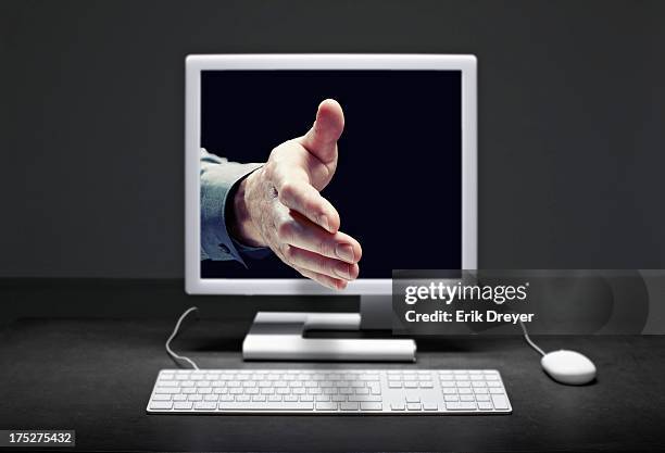 Shaking Hands Computer Screen Photos and Premium High Res Pictures ...