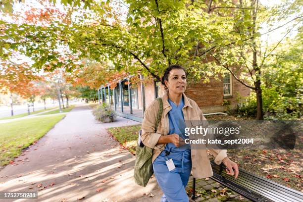 health professional heading to work - summer heading stock pictures, royalty-free photos & images