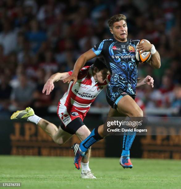 Rob Coote of Exeter Chiefs is chased down by Rhodri McAtee of Gloucester during the J.P. Morgan Asset Management Premiership Rugby 7's held at...