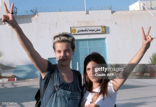 Amina Sboui , a young Tunisian activist with the topless protest group Femen, poses with Tunisian human rights activist Lina Ben Mhenni after being...