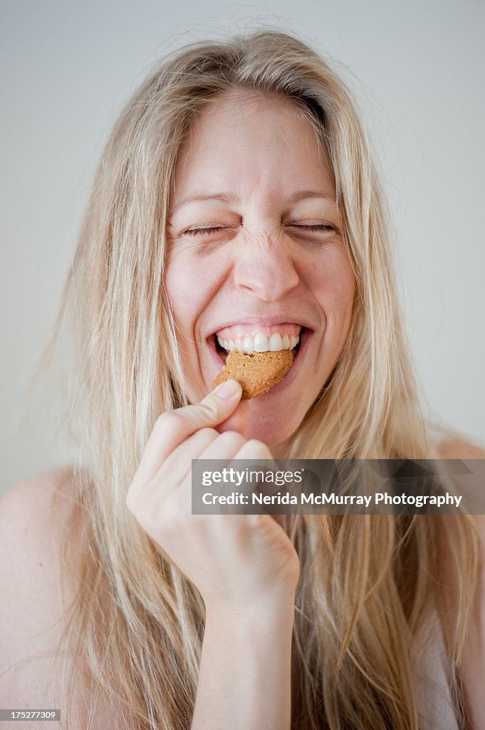 Girl eating biscuit