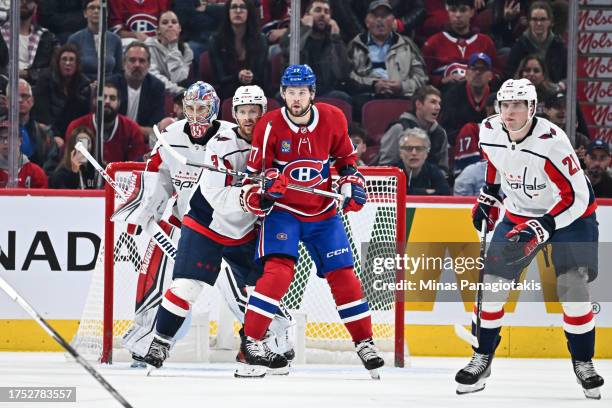 Nick Jensen of the Washington Capitals and Josh Anderson of the Montreal Canadiens battle for position during the first period at the Bell Centre on...