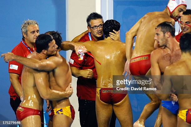 Head coach Vido Lompar of Montenegro celebrates with his players defeating Italy during the Men's Water Polo Semi-Final round between Montenegro and...