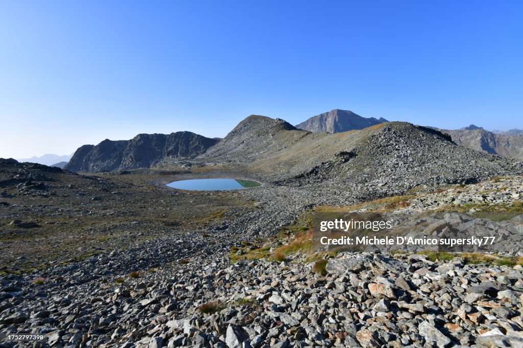 Lake in a high-elevation barren plateau in the Alps
