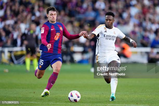 Andreas Christensen centre-back of Barcelona and Denmark and Vinicius Junior left winger of Real Madrid and Brazil compete for the ball during the...