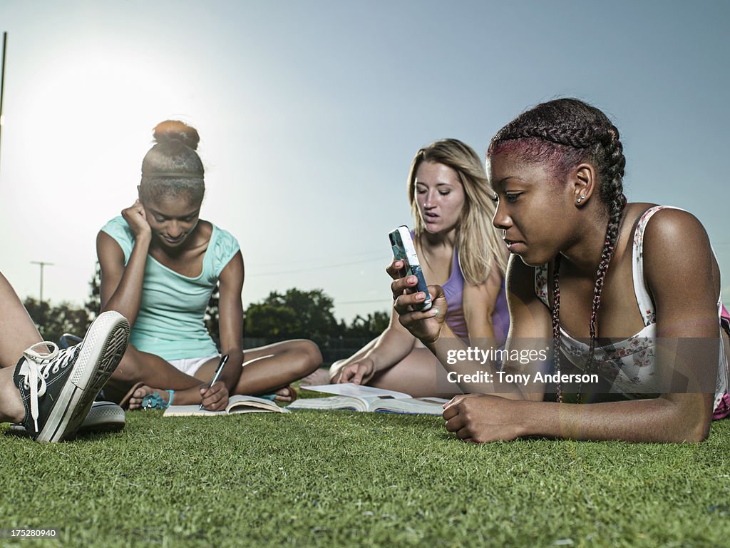 Students hanging out at sports field