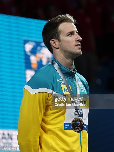 James Magnussen of Australia poses with his Gold medal from the Men's 100m Freestyle Final at the Palau Sant Jordi on day thirteen of the 15th FINA...