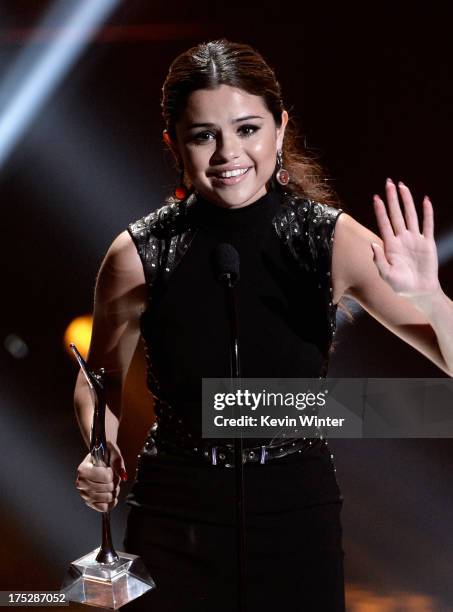 Actress/singer Selena Gomez receives the Fan Favorite Album Award and Most Anticipated Tour Award at the CW Network's 2013 Young Hollywood Awards...