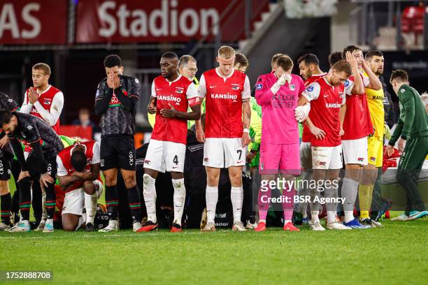 Players of NEC, players of AZ protecting the privacy of Bas Dost of NEC who is down on the ground with a medical emergency during the Dutch...
