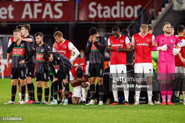 Players of NEC, players of AZ protecting the privacy of Bas Dost of NEC who is down on the ground with a medical emergency during the Dutch...