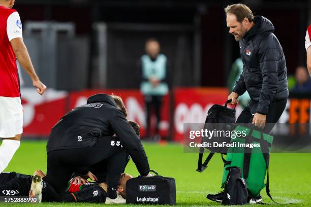 Bas Dost of NEC Nijmegen injured during the Dutch Eredivisie match between AZ Alkmaar and NEC Nijmegen at AFAS Stadion on October 29, 2023 in...