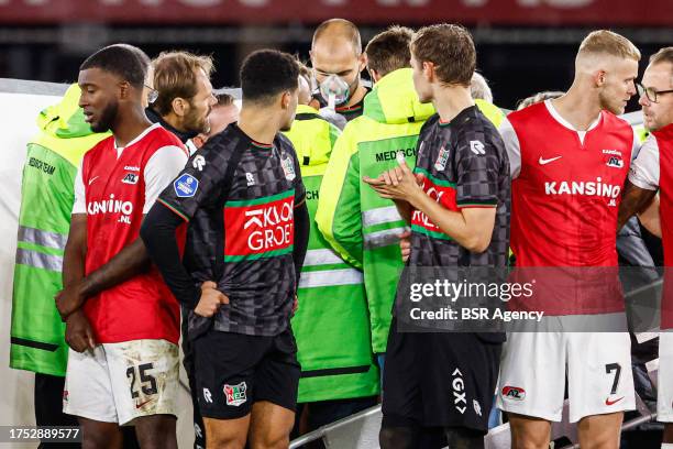 Players of NEC, players of AZ protecting the privacy of Bas Dost of NEC who is down on the ground with a medical emergency during the Dutch...