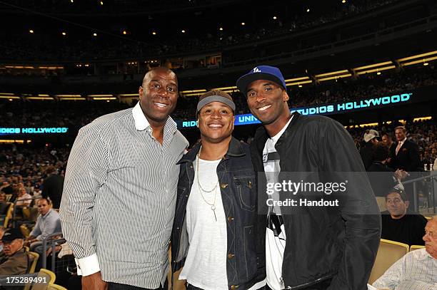 Earvin "Magic" Johnson, rapper LL Cool J and Kobe Bryant of the Los Angeles Lakers attend a game between the Los Angeles Dodgers and the New York...