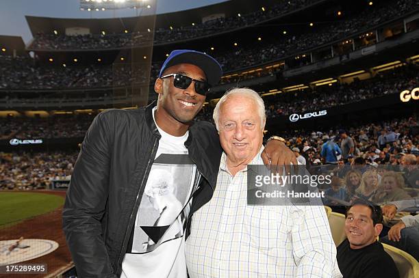 Kobe Bryant of the Los Angeles Lakers and Tommy Lasorda attend a game between the Los Angeles Dodgers and the New York Yankees on July 31, 2013 at...
