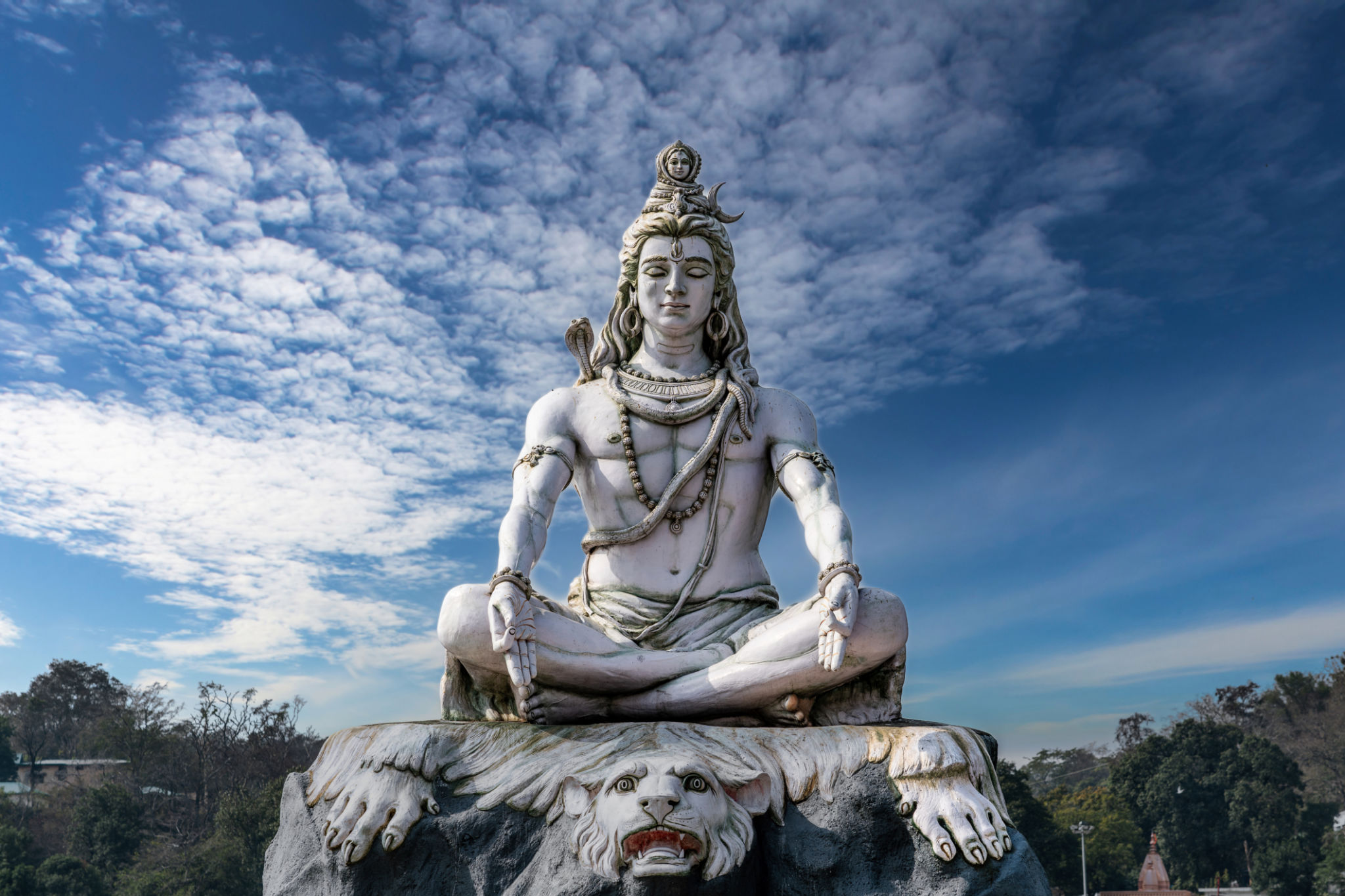 Lord Shiva Statue on the Banks of the Sacred Ganges River in Rishikesh, India Lord Shiva Statue on the Banks of the Sacred Ganges River in Rishikesh, India
