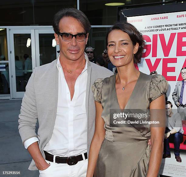 French couturier Lloyd Klein and Bahia Haifi attend a screening of Magnolia Pictures' "I Give It a Year" at ArcLight Hollywood on August 1, 2013 in...