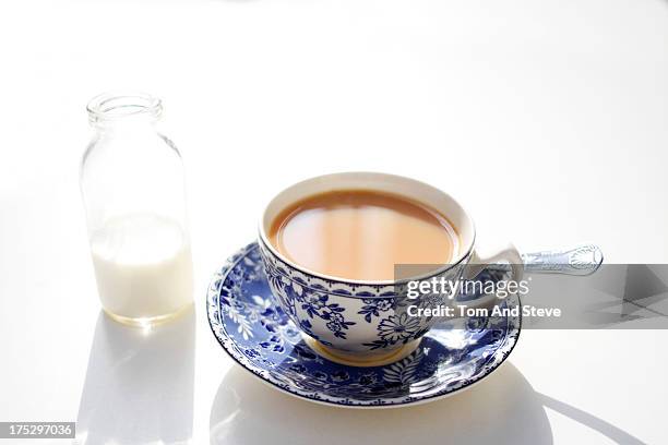 a hot cup of breakfast tea on a white table - 紅茶 ストックフォトと画像