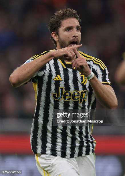 Manuel Locatelli of Juventus celebrates after scoring to give the side a 1-0 lead during the Serie A TIM match between AC Milan and Juventus FC at...
