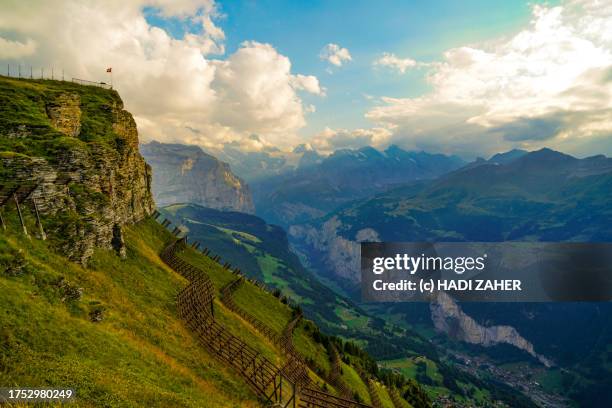 a high angle view of the lauterbrunnen valley from mannlichen mountain in the swiss alps - monch stock pictures, royalty-free photos & images