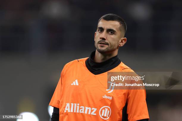 Mattia Perin of Juventus looks on during the warm up prior to the Serie A TIM match between AC Milan and Juventus FC at Stadio Giuseppe Meazza on...