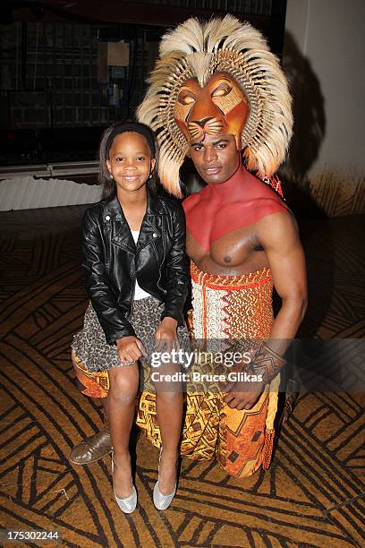 Quvenzhané Wallis and Andile Gumbi as "Simba" pose backstage at the hit musical "The Lion King" on Broadway at The Minskoff Theater on August 1, 2013...