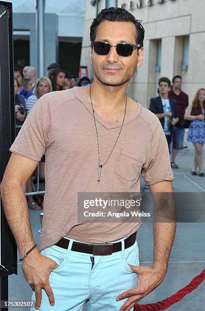 Actor Cas Anvar arrives at the Screening of Magnolia Pictures' 'I Give It A Year' at ArcLight Hollywood on August 1, 2013 in Hollywood, California.