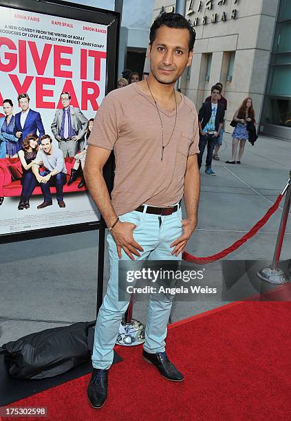 Actor Cas Anvar arrives at the Screening of Magnolia Pictures' 'I Give It A Year' at ArcLight Hollywood on August 1, 2013 in Hollywood, California.