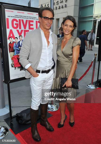 Fashion designer Lloyd Klein and actress Bahia Haifi arrive at the Screening of Magnolia Pictures' 'I Give It A Year' at ArcLight Hollywood on August...