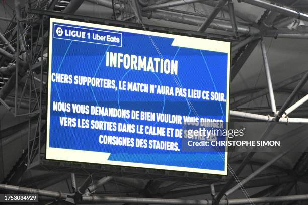 Photograph taken at Stade Velodrome in Marseille, southern France on October 29 shows an information board announcing supporters that the Ligue 1...